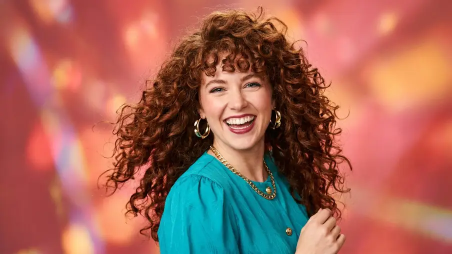 The 1980s Voluminous Perm with Wavy Bangs